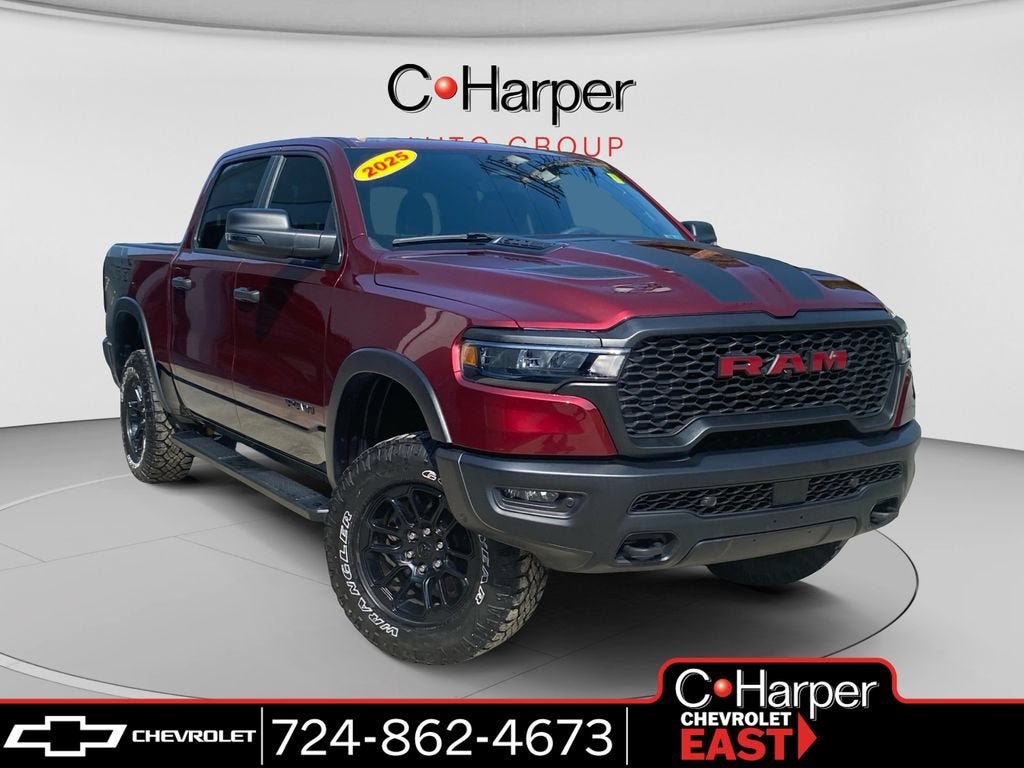 2025 RAM 1500 Rebel Crew Cab 4x4 5'7" Box in Red — front three-quarter view